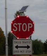 Red octogonal stop sign with red LEDs at each vertex